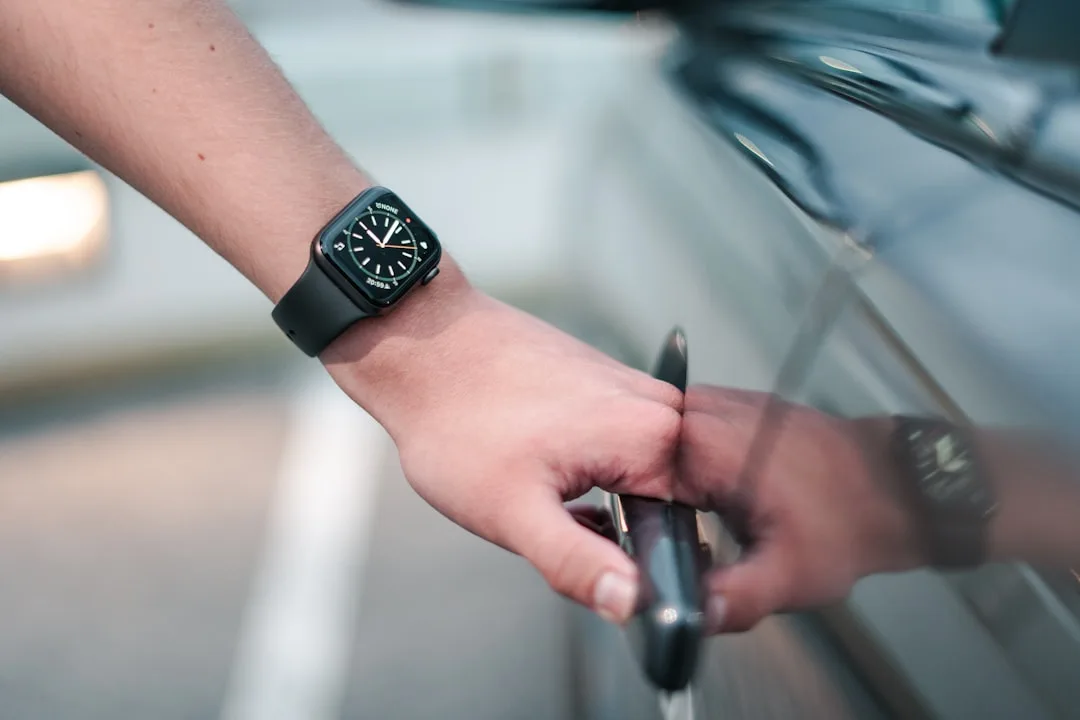 Close-up of biometric fingerprint reader on luxury car door handle