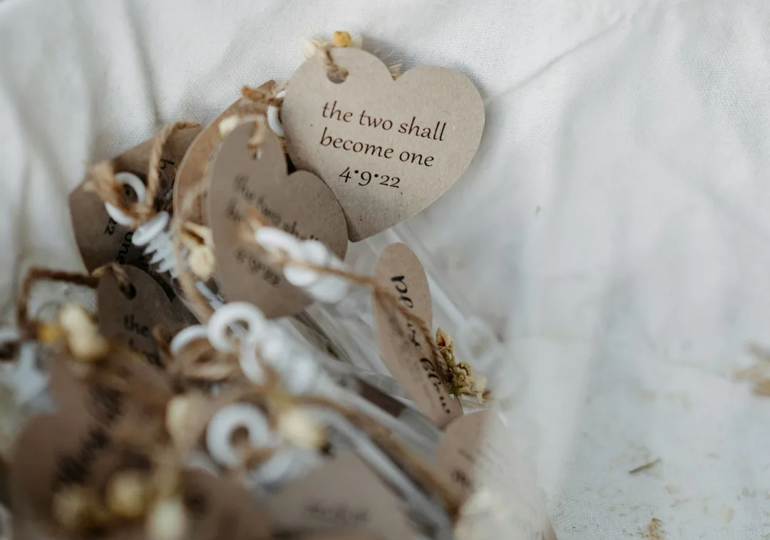 Personalized wedding favors with organic seed packets and kraft paper wrapping on white surface