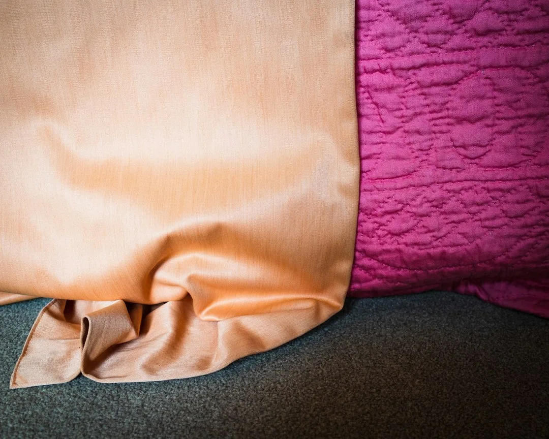 Woman sleeping on silk pillowcase showing smooth skin and healthy hair