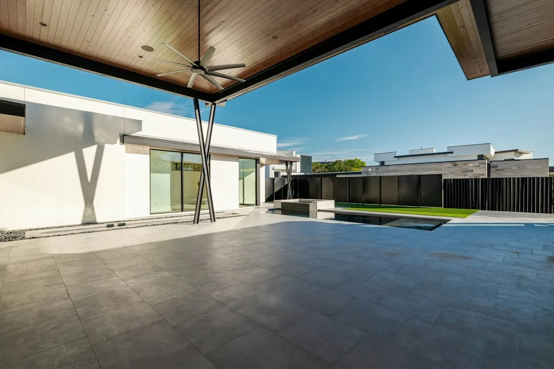 Modern corner shade structure anchoring outdoor seating zone