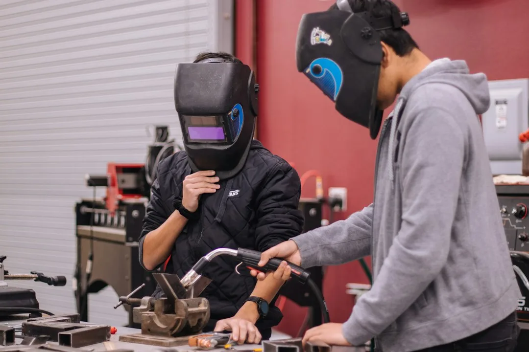 Employer reviewing vocational certification credentials during interview