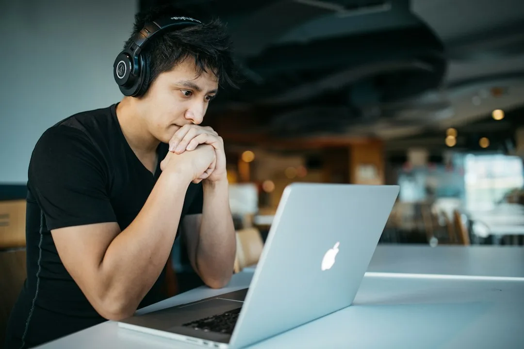 Professional using spaced repetition learning software on desktop computer