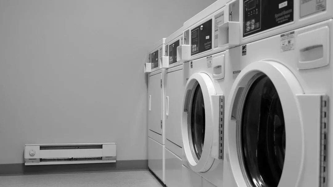 Professional laundry room ventilation fan mounted with rigid metal ductwork