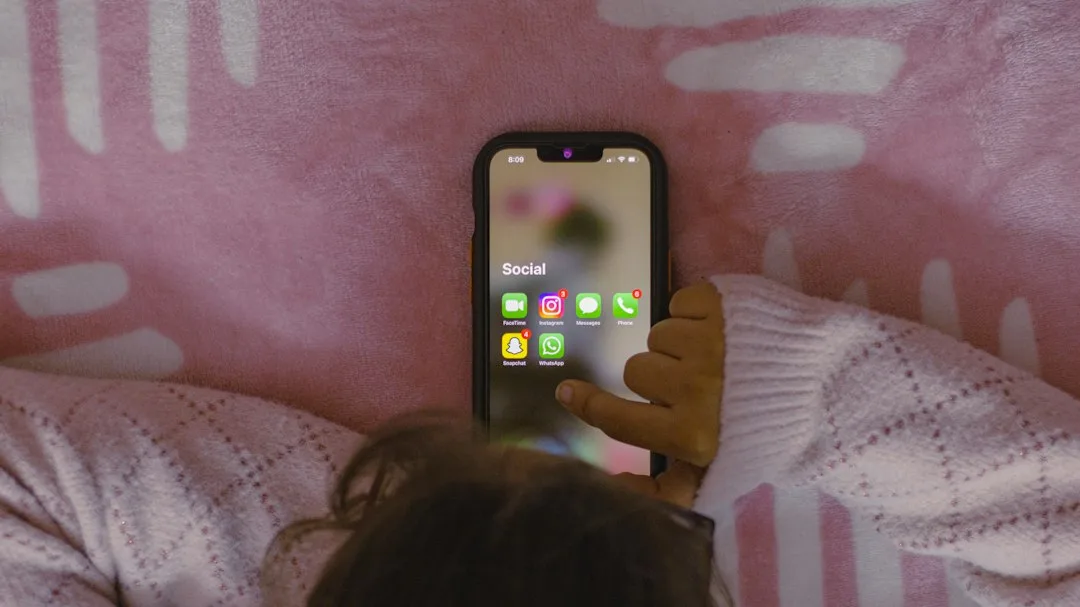 Parent and child discussing digital privacy and data consent at home