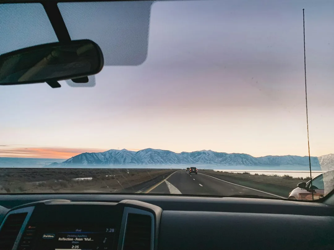Rear-facing dash camera cable routed along the headliner and A-pillar trim