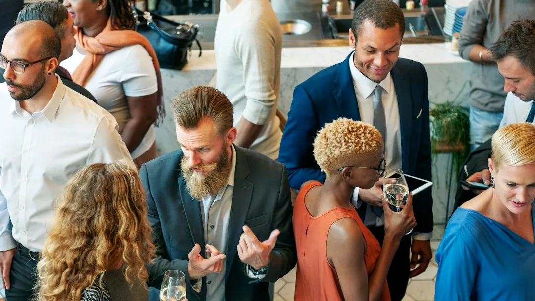 Close-up of cocktail party event bartender pouring craft drink at standing bar