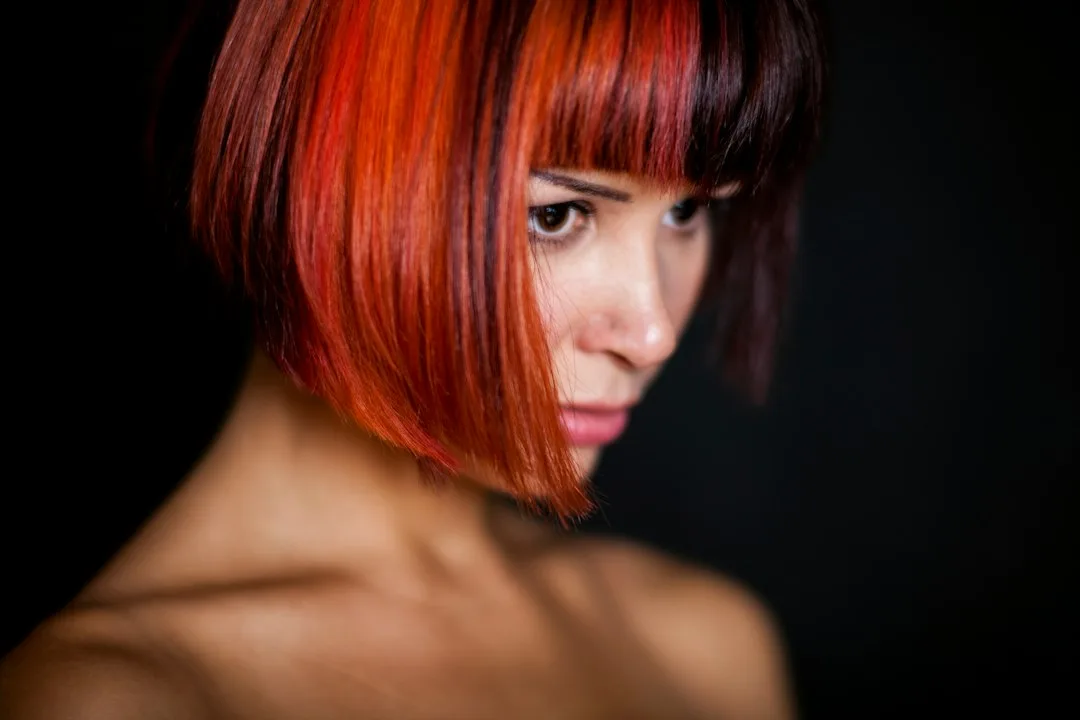 Close-up of curved bangs styled smooth with flat iron technique