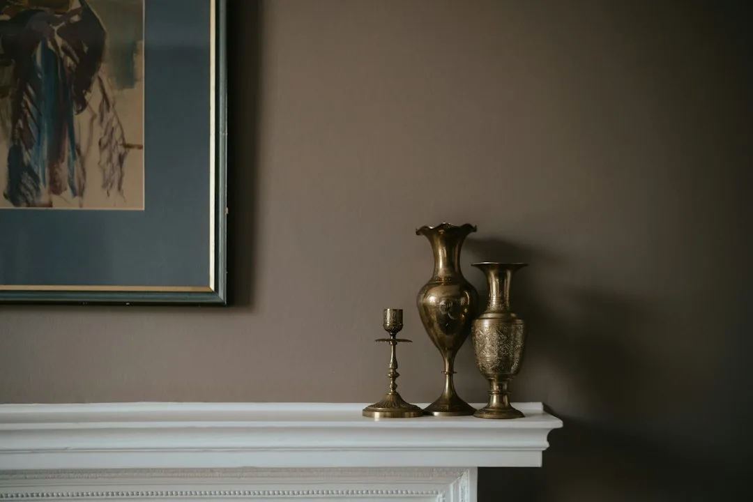 Close-up of textured warm metallic wall finish showing burnished copper surface detail