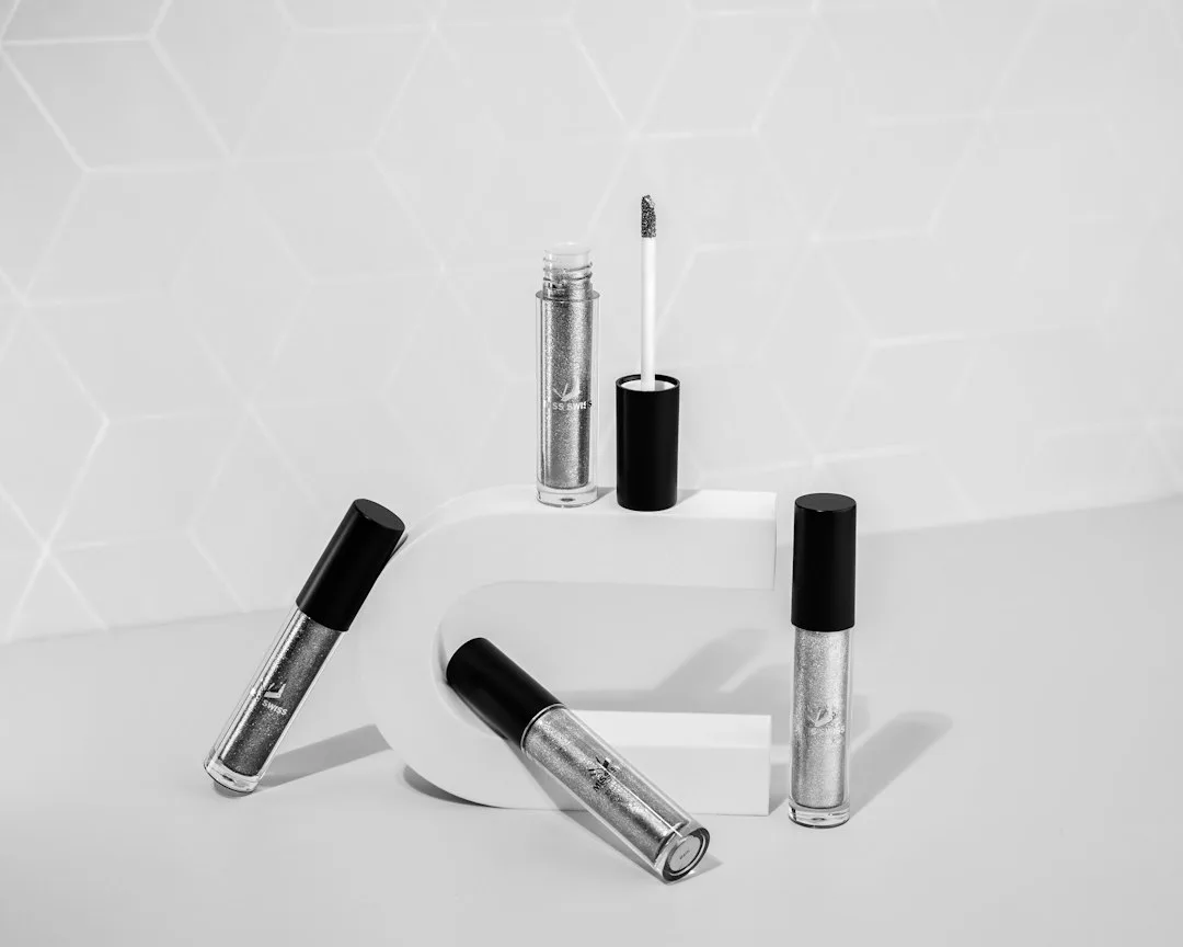 Close-up of a peptide serum being applied to the upper lash line before bed