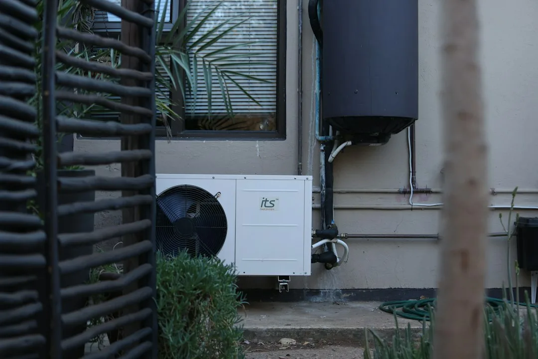 Basement utility room with a tall water heater and open space for air circulation