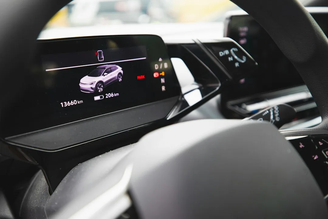 Electric car infotainment screen showing a software update progress bar